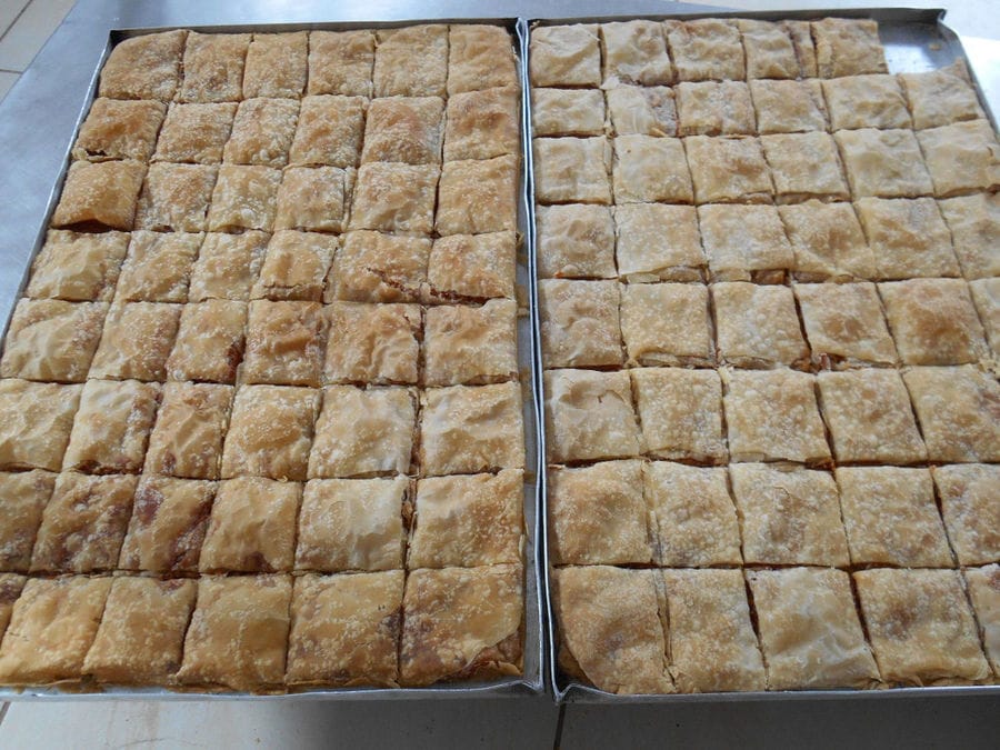 cutting baking pans at 'Agrotouristic Women's Cooperative of Mesotopos Lesvos'